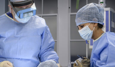 maxillofacial surgeon in operating theatre