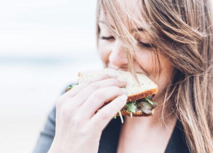 woman eating sandwich